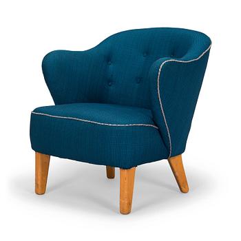 Flemming Lassen, an armchair manufactured by Asko 1952-1956.