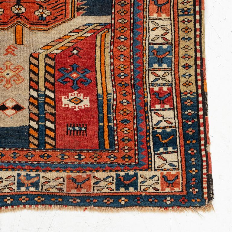 A Caucasian, antique rug, c. 225 x 125 cm.