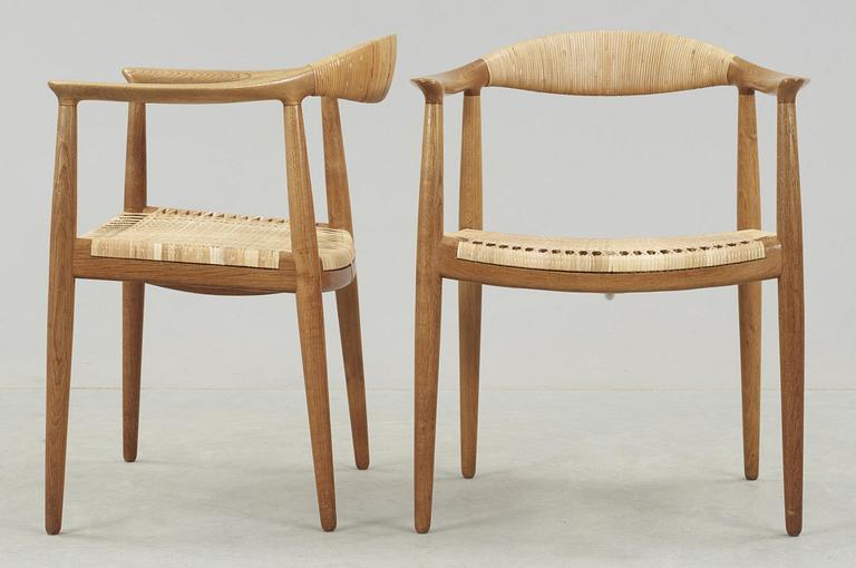 A pair of Hans J Wegner oak and rattan 'The Chair' armchairs by Johannes Hansen, Denmark.