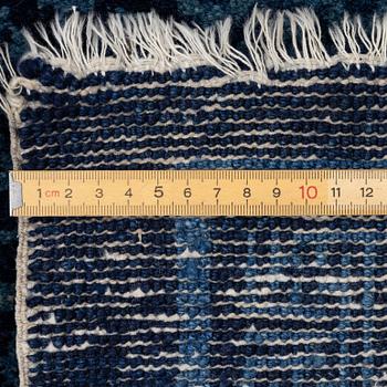An antique Baotou carpet, north China, c. 257 x 155 cm.