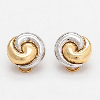 A pair of 18K white and yellow gold earrings.