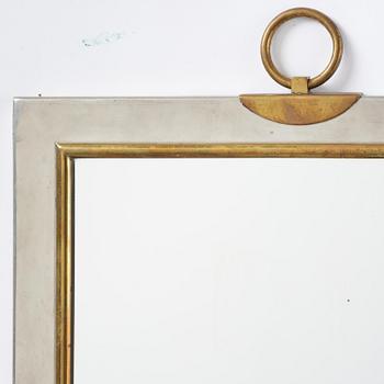 Firma Svenskt Tenn, a pewter and brass wall mirror model 2283, Firma Svenskt Tenn, Stockholm, 1952.