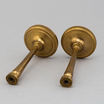 A pair of empire burnt gilt curtain holders, first half of the 20th century.