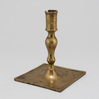 A Baroque brass candlestick, early 18th century.