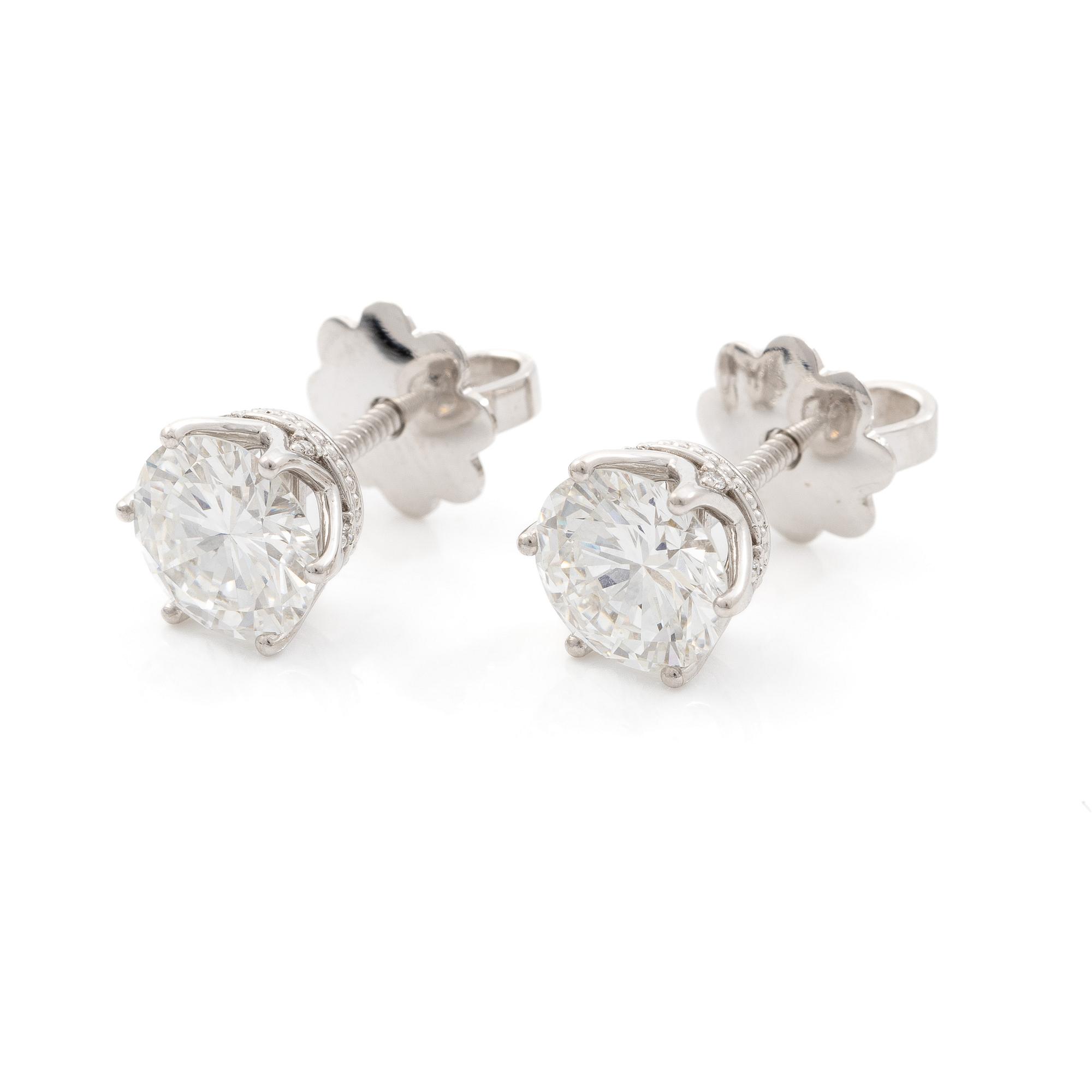 Earrings, single-stone earrings in 18K white gold with brilliant-cut diamonds, accompanied by IGI report.