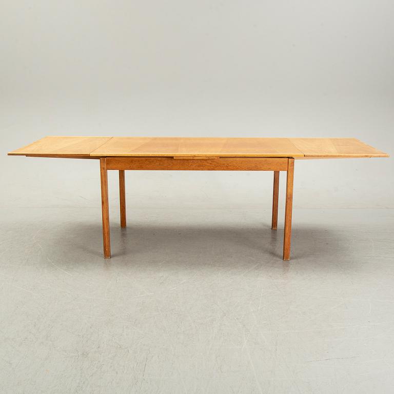 Knud Andersen, a set of six chairs for J.C.A Andersen, Aarhus, Denmark and a dinner table from Troeds, Bjärnum.