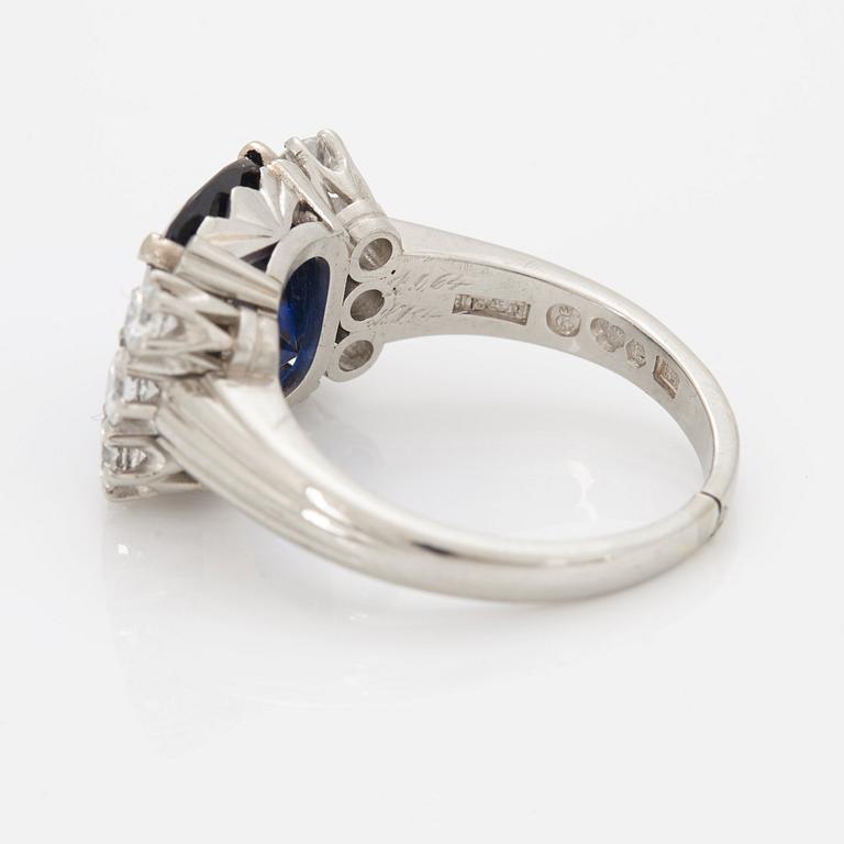 A RING set with a faceted sapphire.