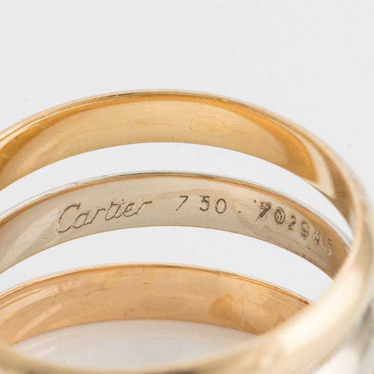 An 18K gold Cartier ring.