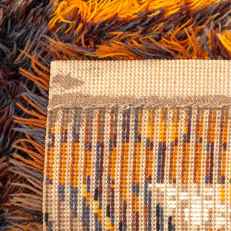 A pair of machine made long pile rugs ca 190 x 137 cm each.
