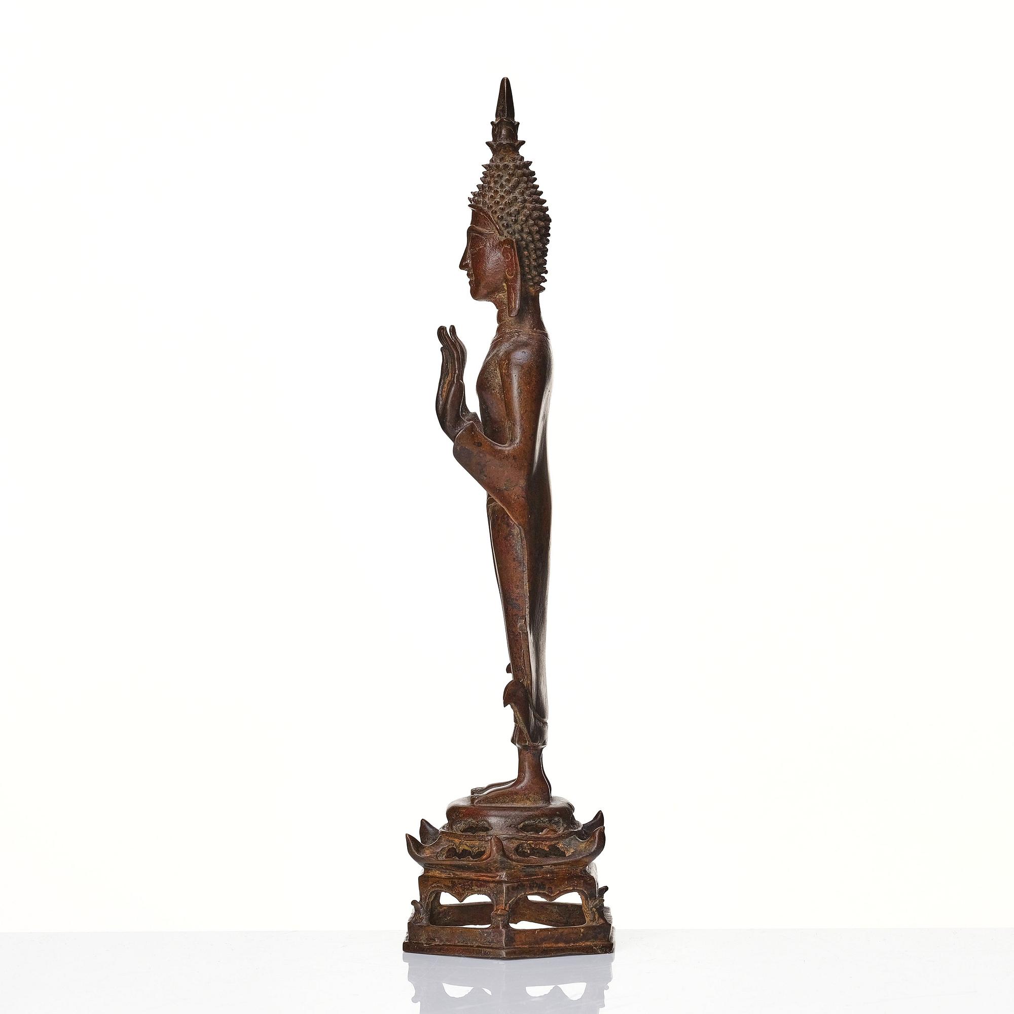 A standing sculpture of buddha, Laos, 18th Century.