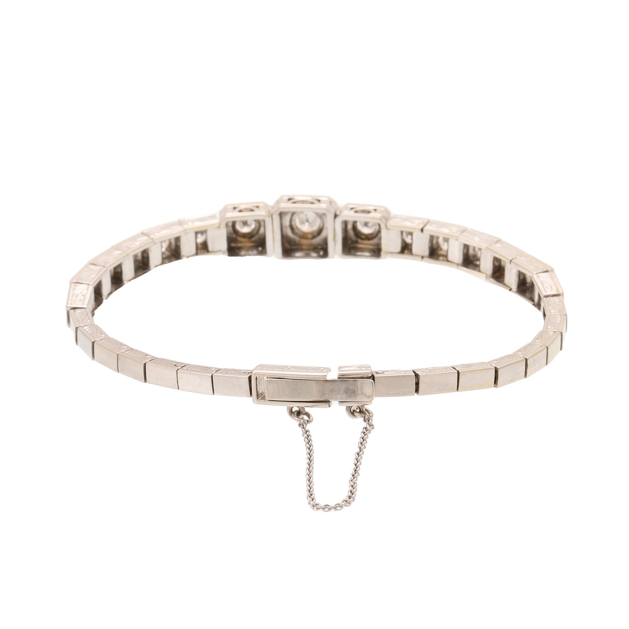 An 18K white gold bracelet with brilliant cut diamonds.