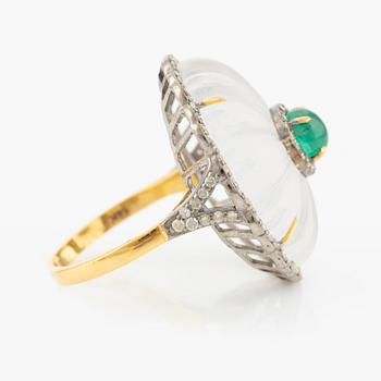 Ring with cut rock crystal, diamonds, and cabochon-cut emerald.