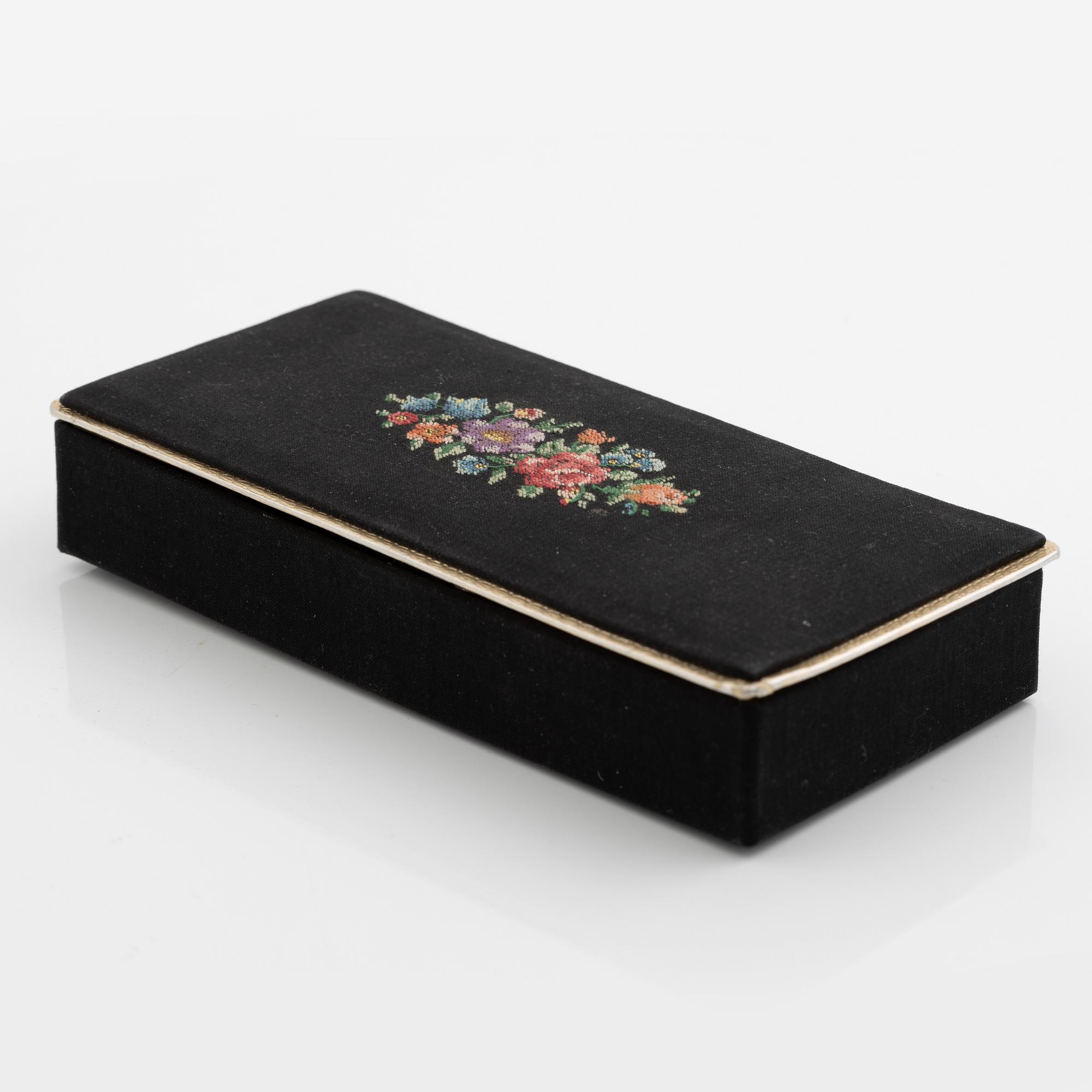 Necklace with matching earrings, white metal in floral design with glass stones.