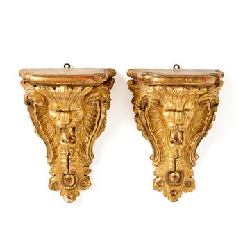 155. A pair of Swedish rococo giltwood consoles in the manner of C. Hårleman, Stockholm mid 18th century.