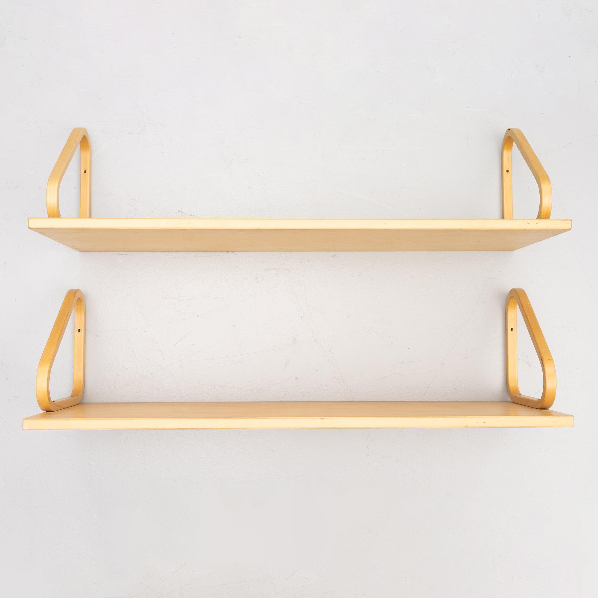 Alvar Aalto, a pair of wall shelves, model 112A, Artek, Finland, late 20th Century.
