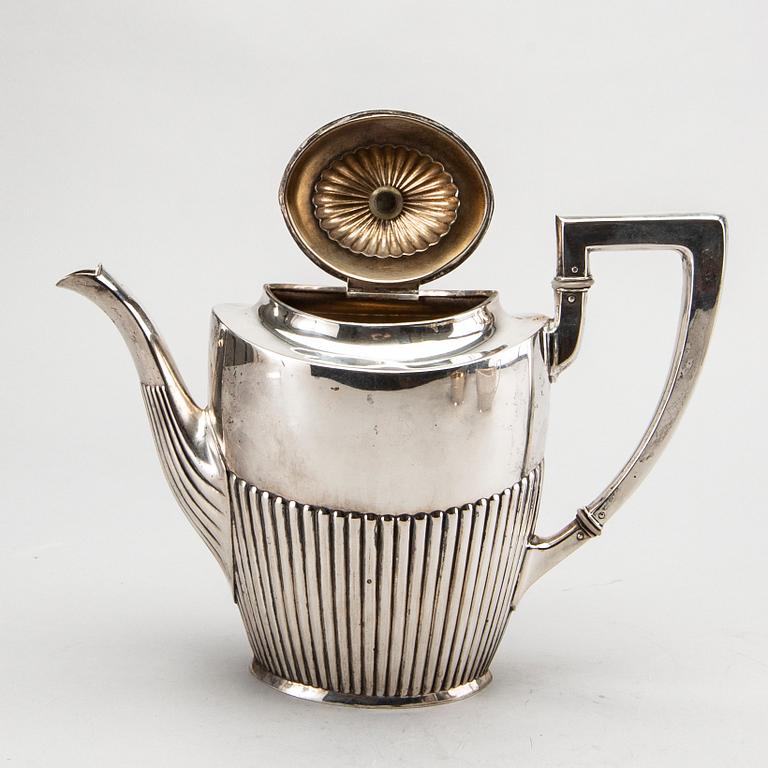 A three piece silver coffee service mark of CG Hallberg Stockholm 1916, weight 896 gram.