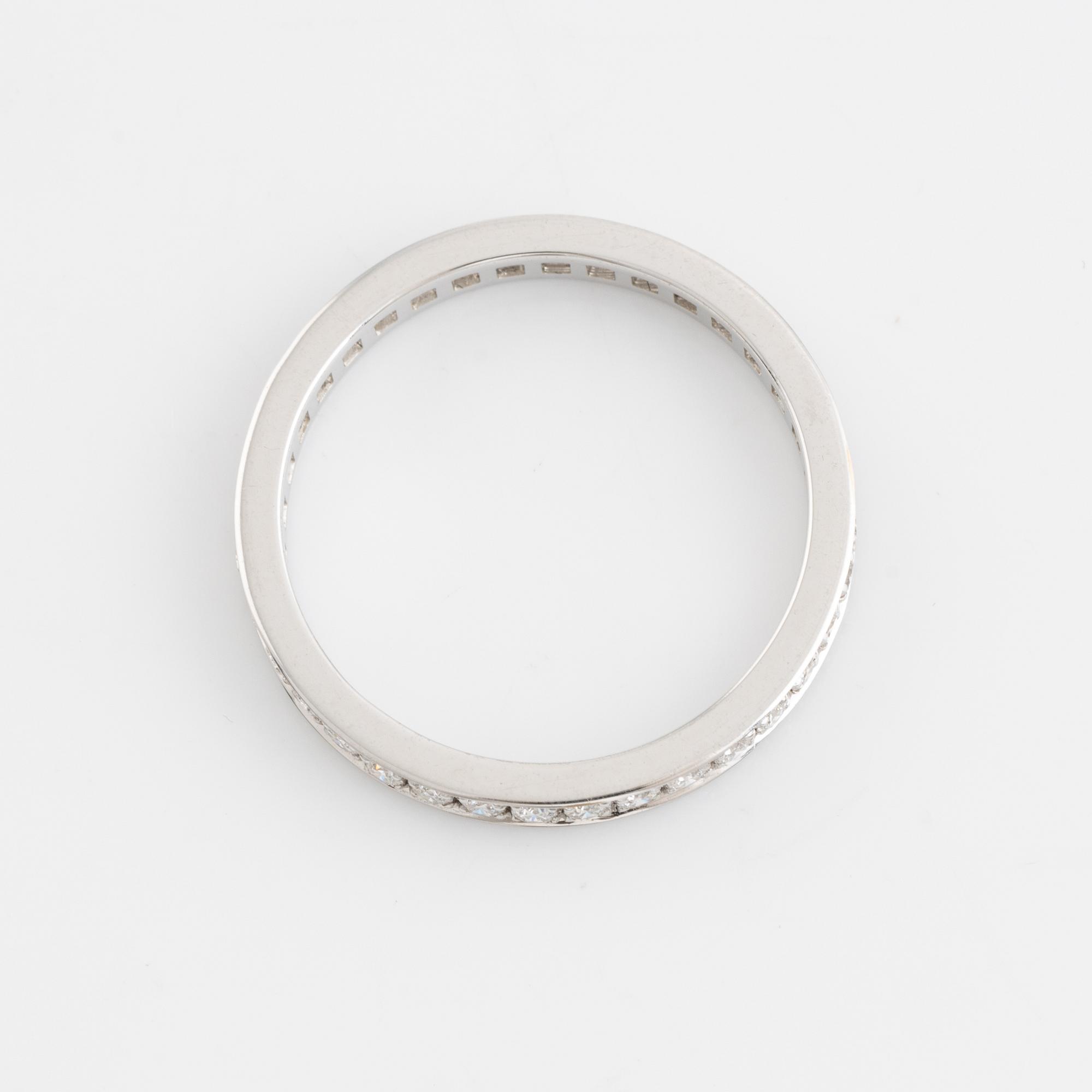 Brilliant cut diamond eternity ring.