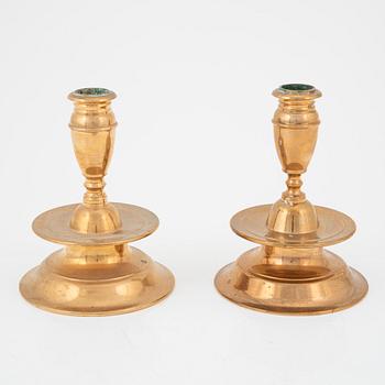 A set of eight brass baroque-style candlesticks from FMM Mora, later part of the 20th century.