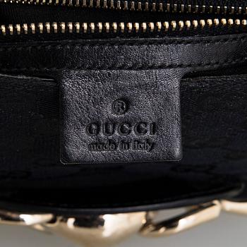 Gucci, a handbag.