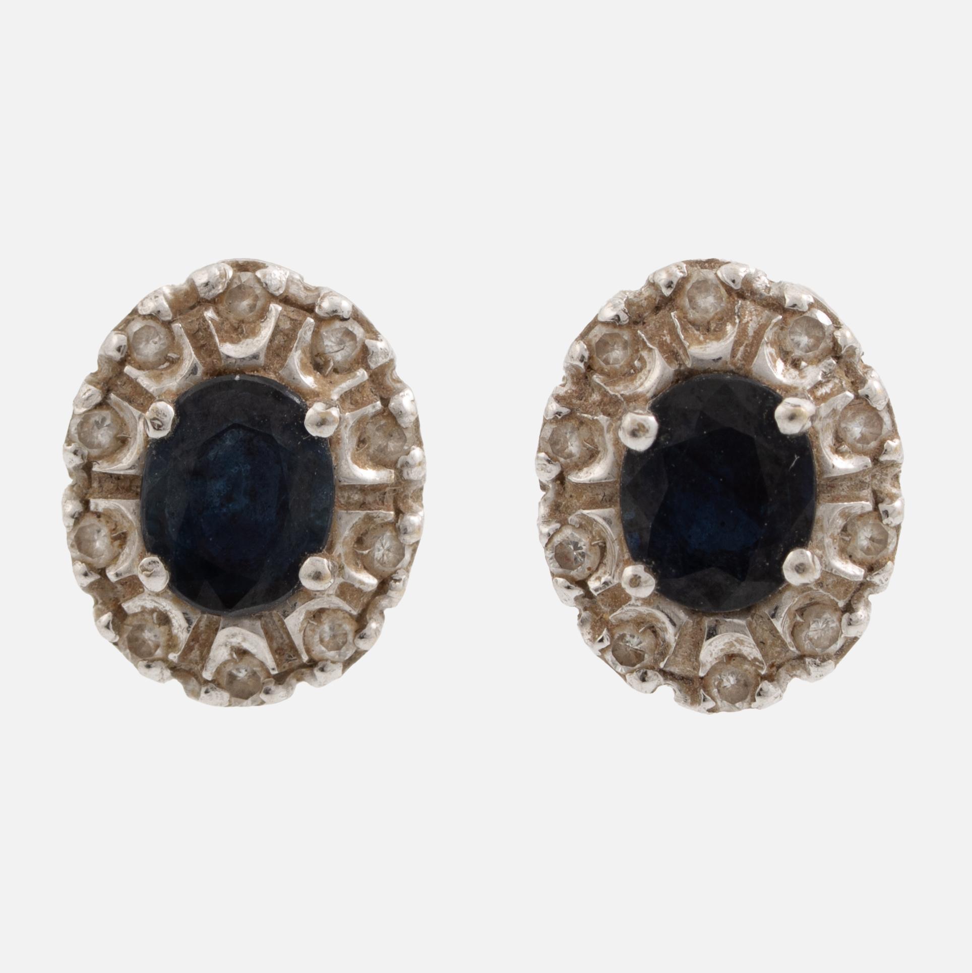 Earrings, a pair of 18K white gold set with dark sapphires and small brilliant-cut diamonds.
