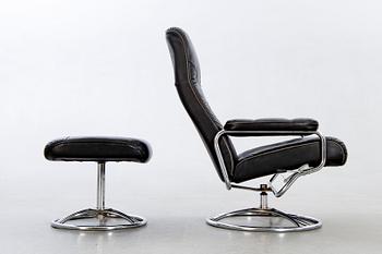 A leather swivel armchair and stool, Söderbergs  1980s.