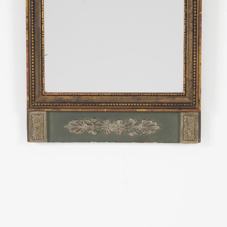 An Empire style mirror, first half of the 20th century.