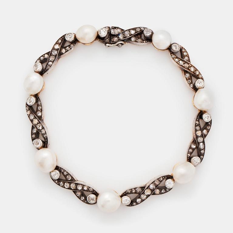 A bracelet in 18K gold and silver set with pearls and old- and rose-cut diamonds.