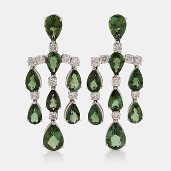 A pair of chandelier earrings in 18K white gold set with green tourmalines and round brilliant-cut diamonds.