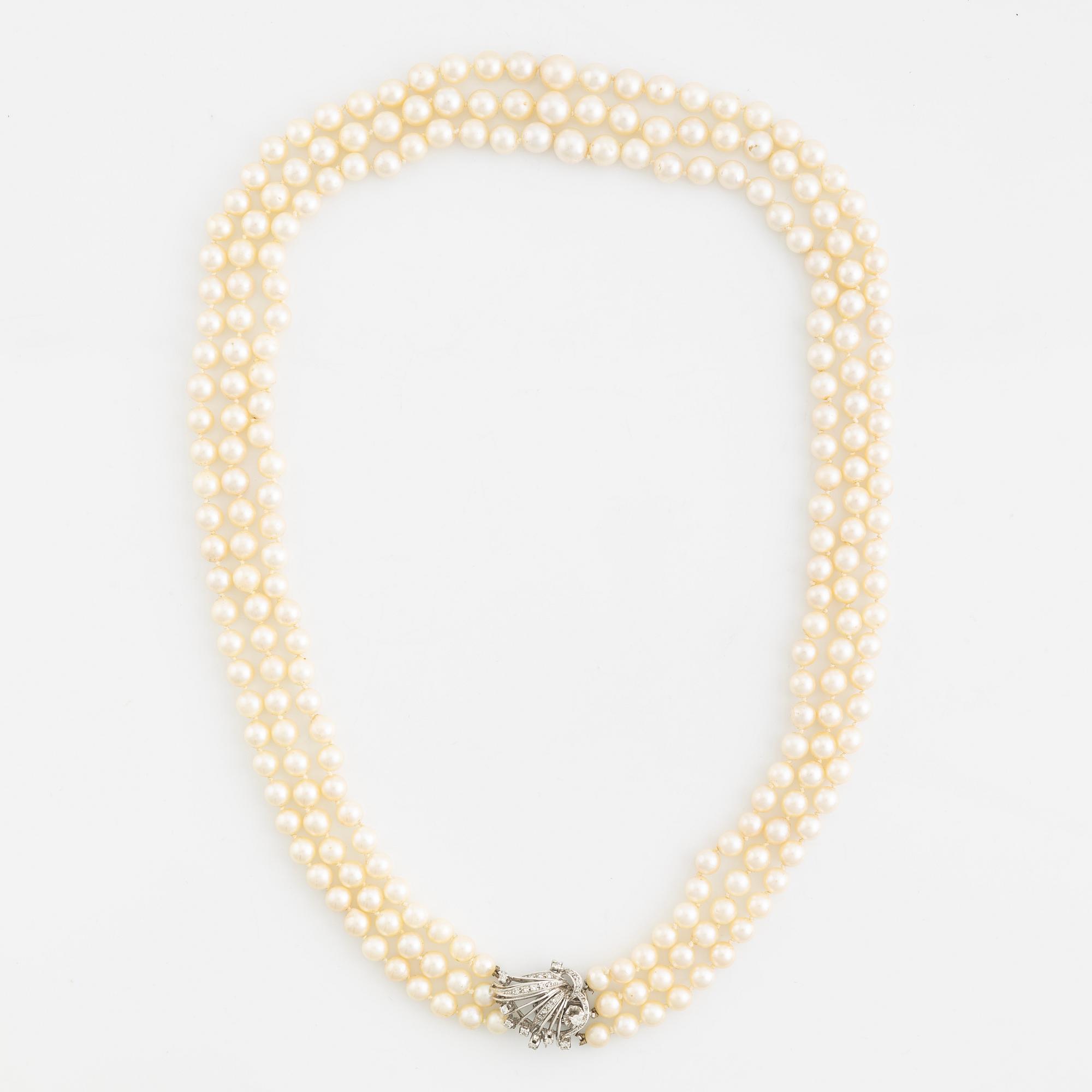 Cultured pearl necklace, three strand, calibrated, clasp with diamonds.