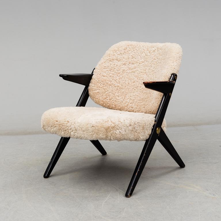 A 1950's 'Triva' easy chair by Bengt Ruda, from Nordiska Kompaniet.