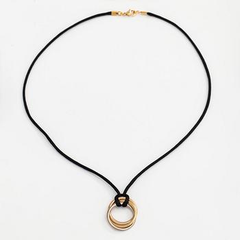 Cartier, necklace/pendant, "Trinity", 18K tricolour gold with black silk cord.