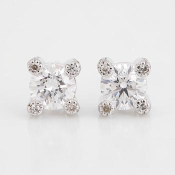 Brilliant-cut diamond stud earrings.