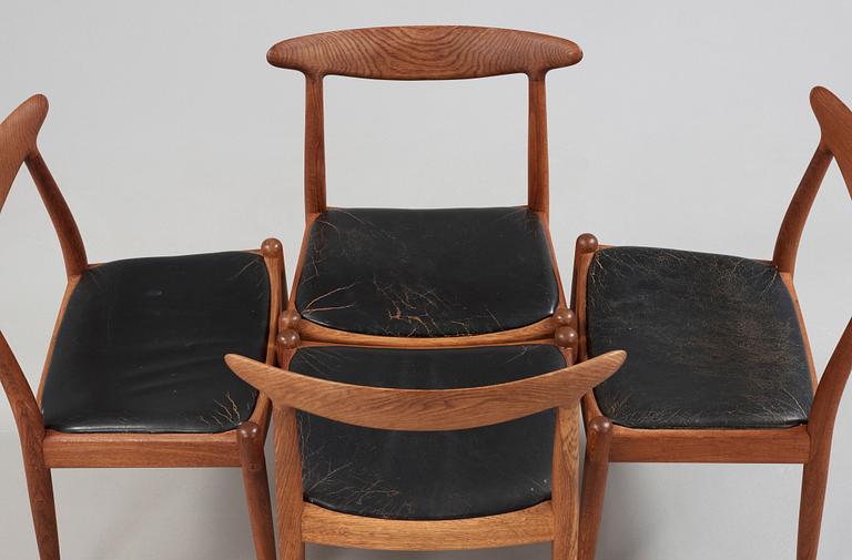 A Hans J Wegner oak dinner table 'AT 312' and four oak and black leather chairs, C M Madsen, Denmark 1950-60's.