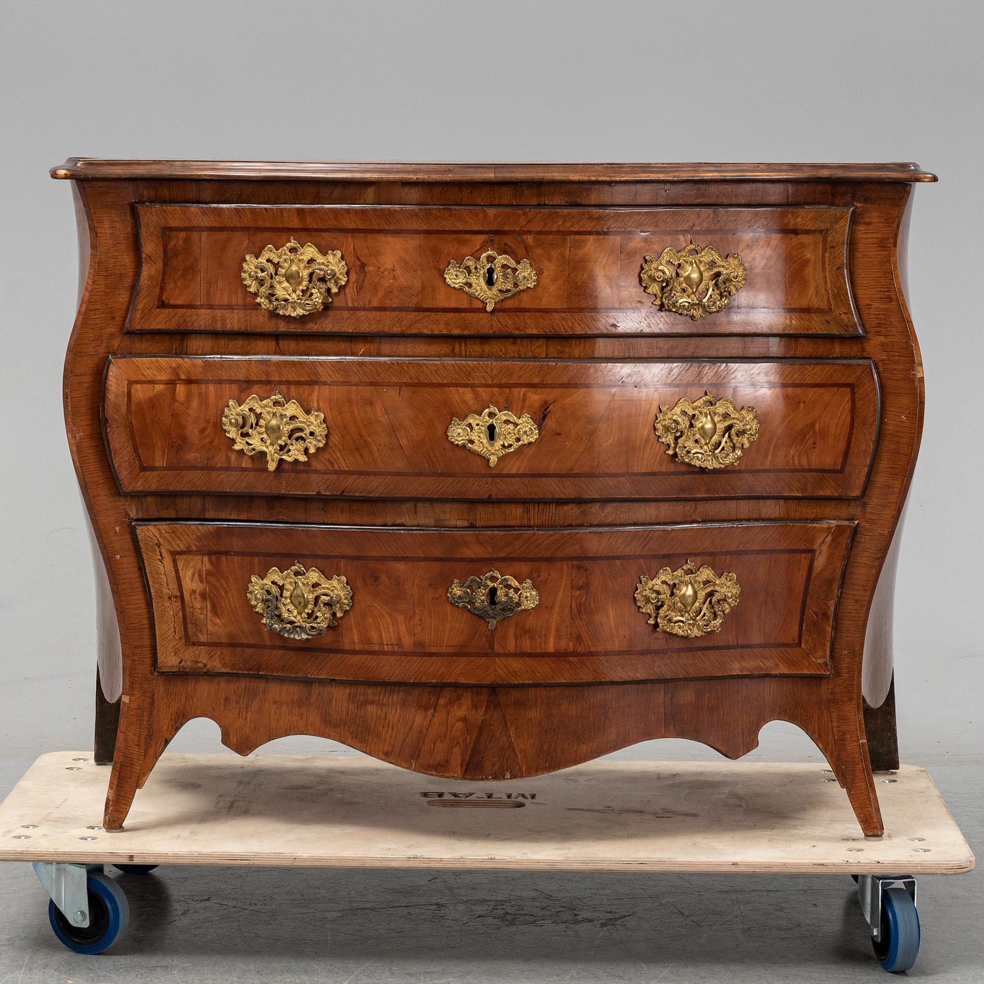 a mid 1700's rococo chest of drawers.
