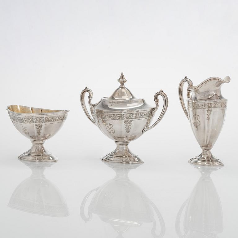 A five-piece sterling silver coffee and tea service, and 12 spoons, USA, first quarter of the 20th century.