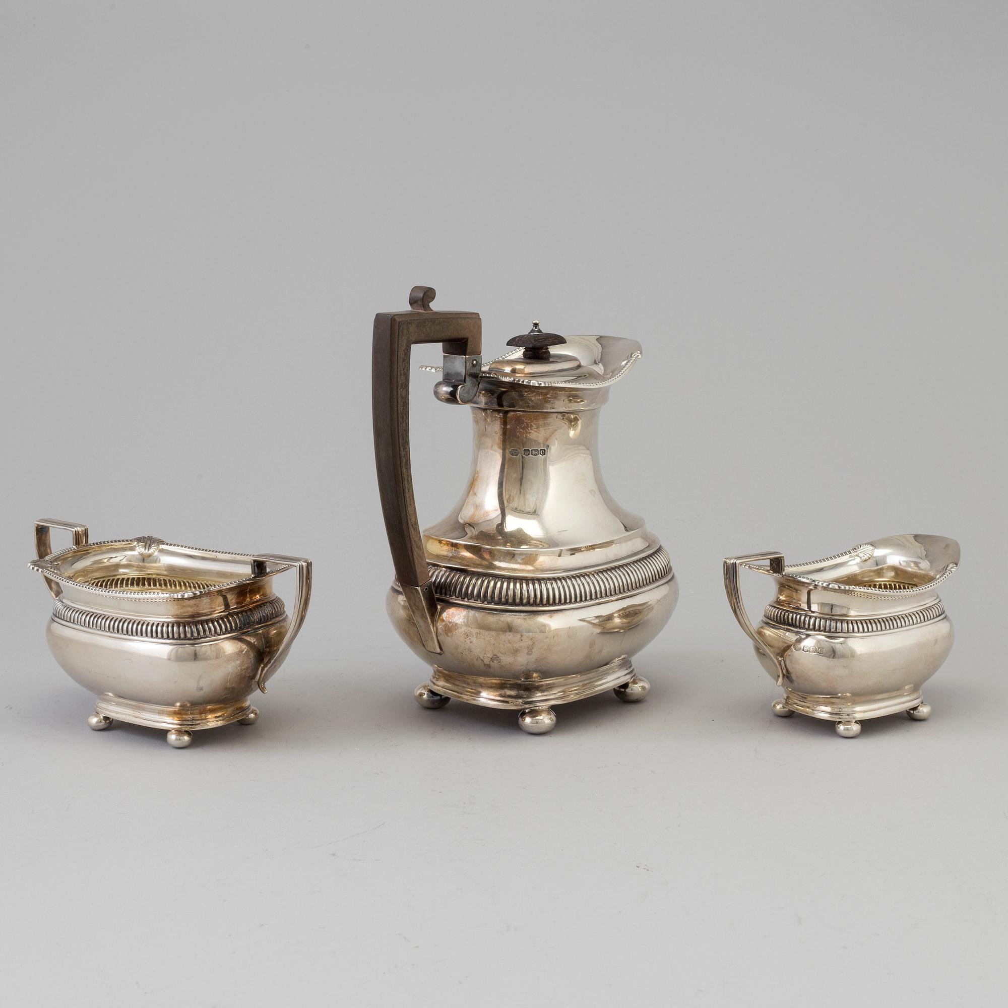 A three piece silver coffee set by The Alex Clark Company, London, first half of the 20th century.