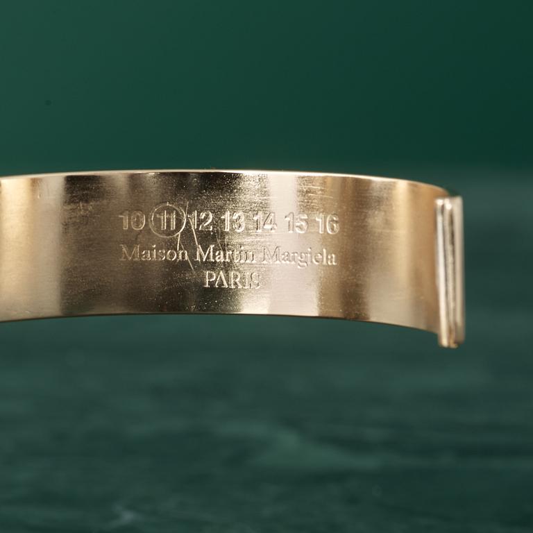 A bracelet by MARTIN MARGIELA.