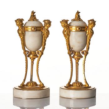 A pair of Louis XVI Cassolettes, white marble and gilt-bronze, around 1790.