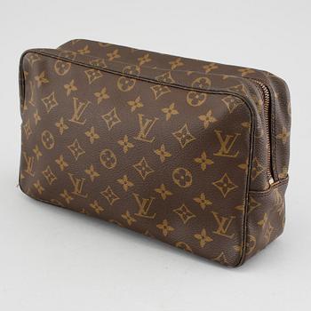 A Louis Vuitton "Trousse Toilette 28" beauty bag.