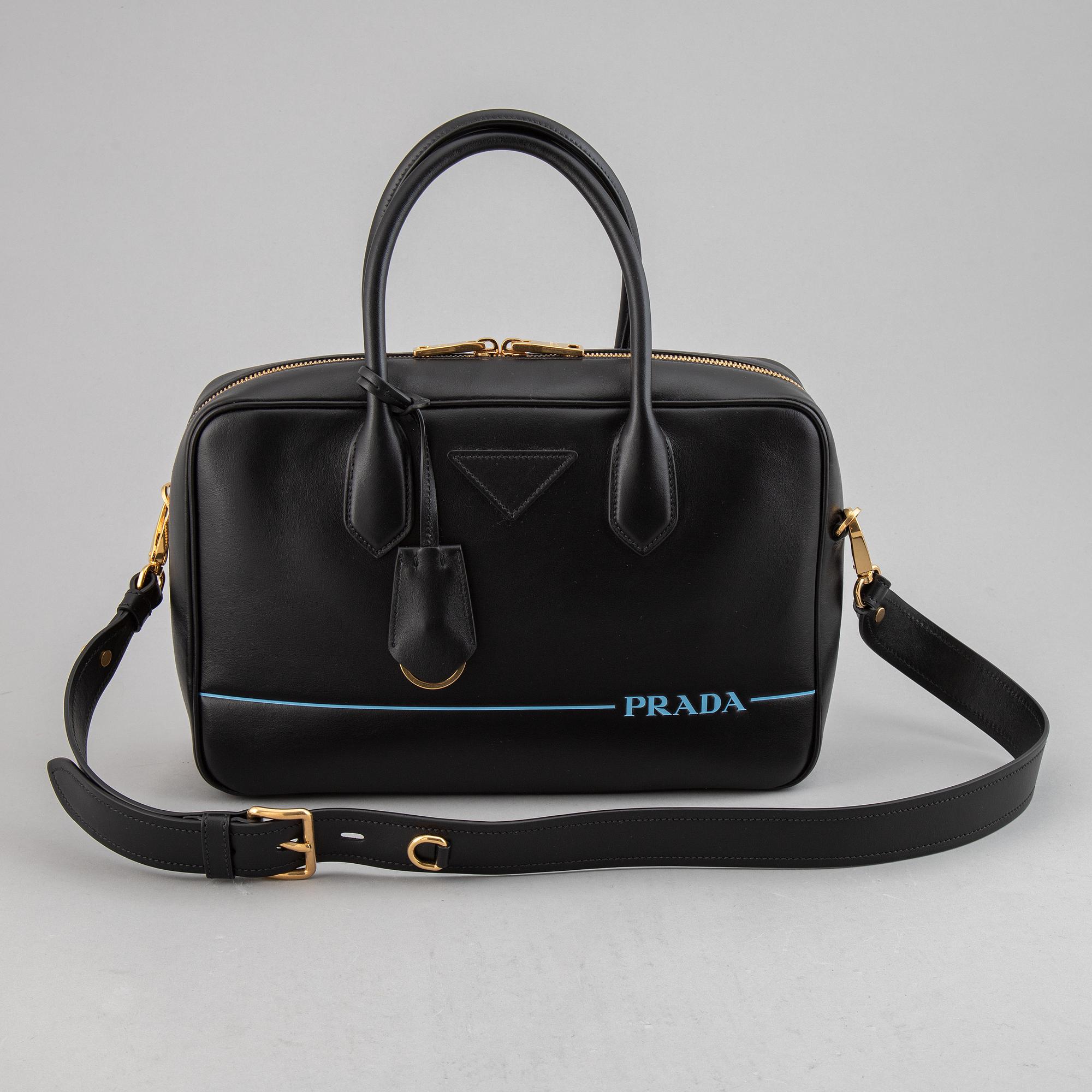 PRADA, a leather bag.