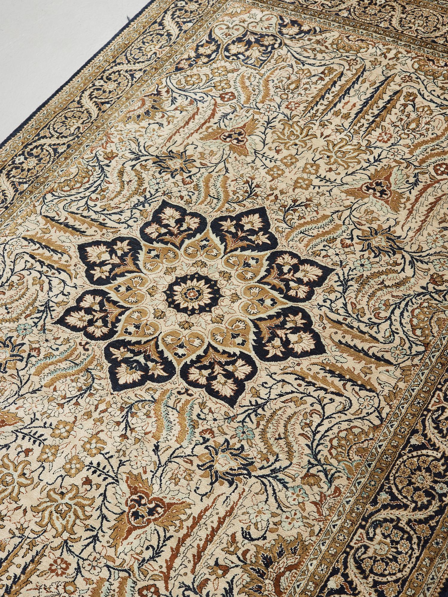 A silk Qum carpet, around  219 x 137 cm.