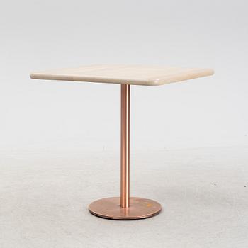 A steel and oak table by Jonas Lindvall 2011.