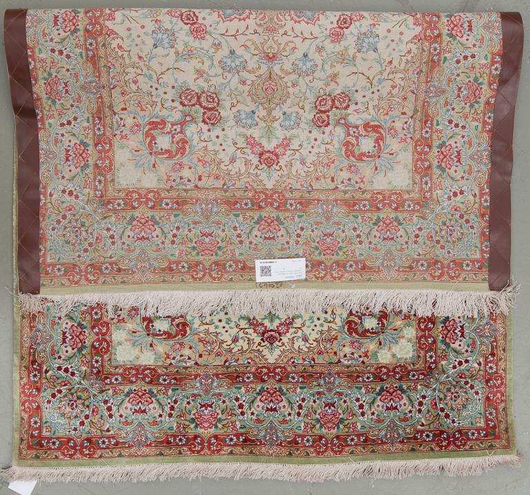 An oriental silk rug, possibly Qum, around 141 x 100 cm.