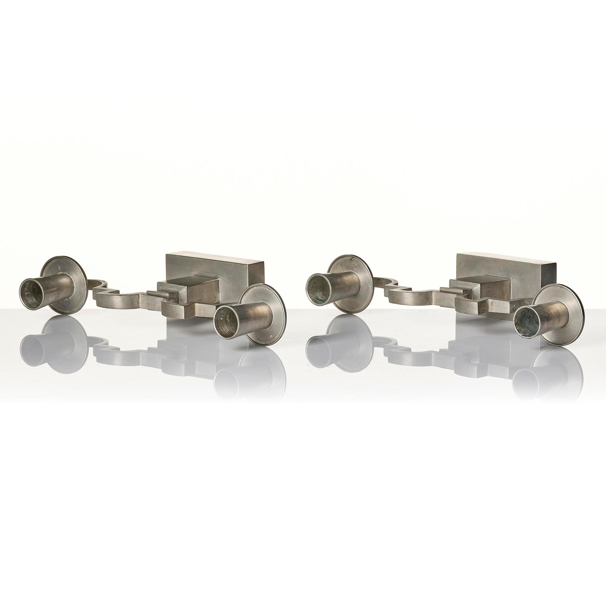 Nils Fougstedt, a pair of pewter candelabra model "A 1047", Firma Svenskt Tenn, Stockholm 1932.