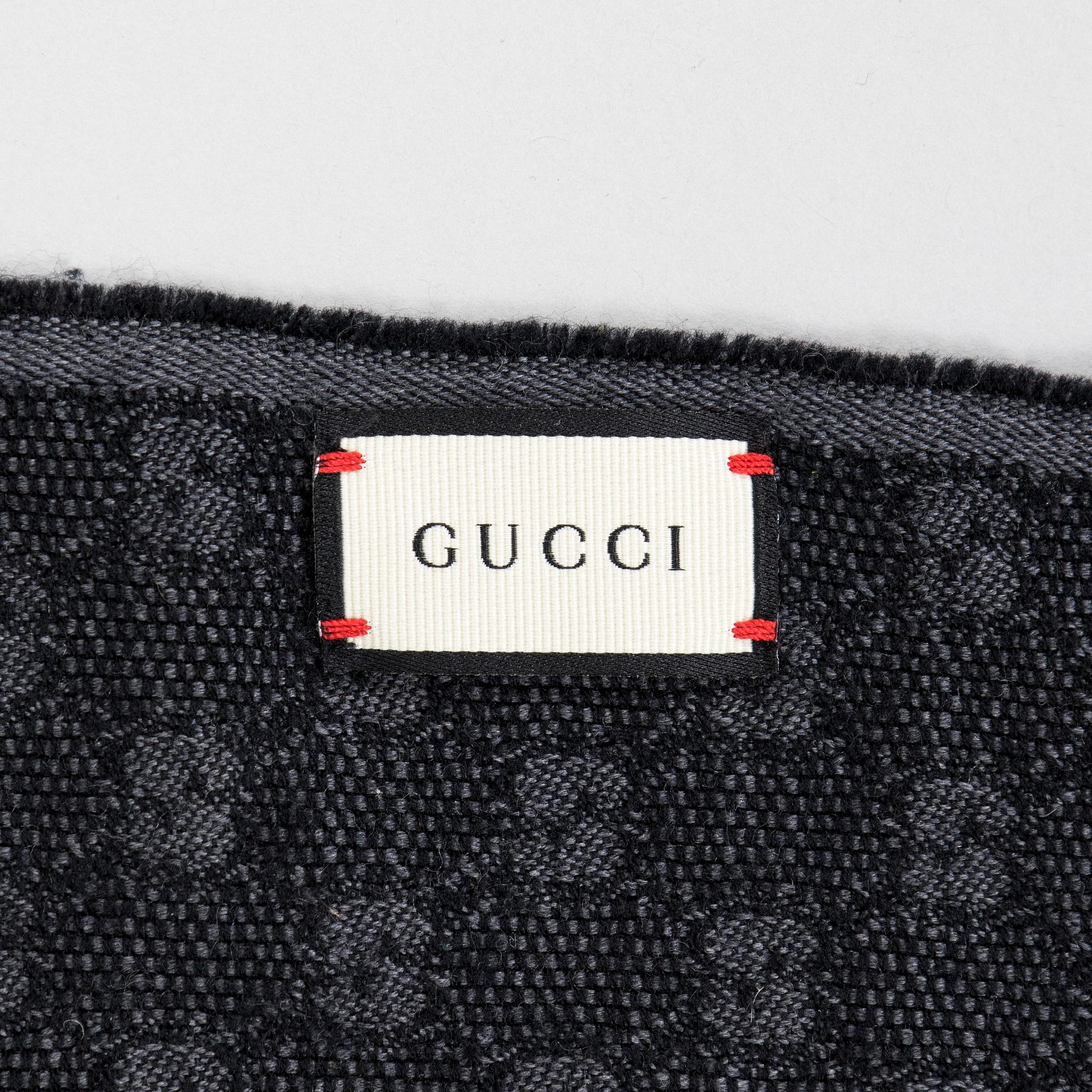 Gucci, A 'Verbier' scarf and a belt.