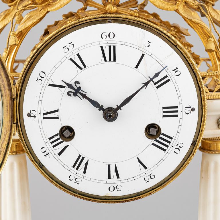 A Louis XVI marble and gilt bronze mantel clock, late 18th Century.