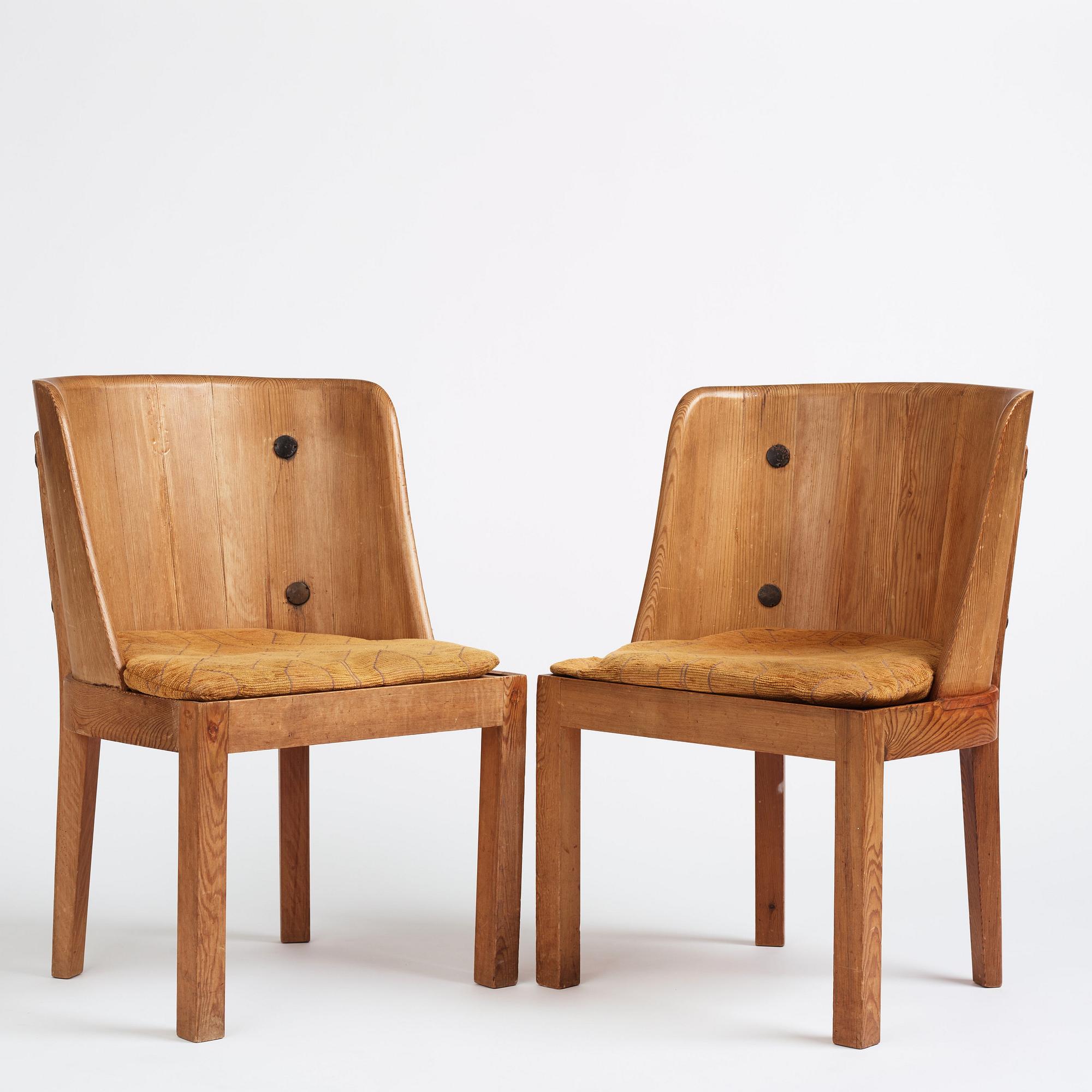 Axel Einar Hjorth, a pair of stained pine 'Lovö' chairs, Nordiska Kompaniet, Sweden 1930s.
