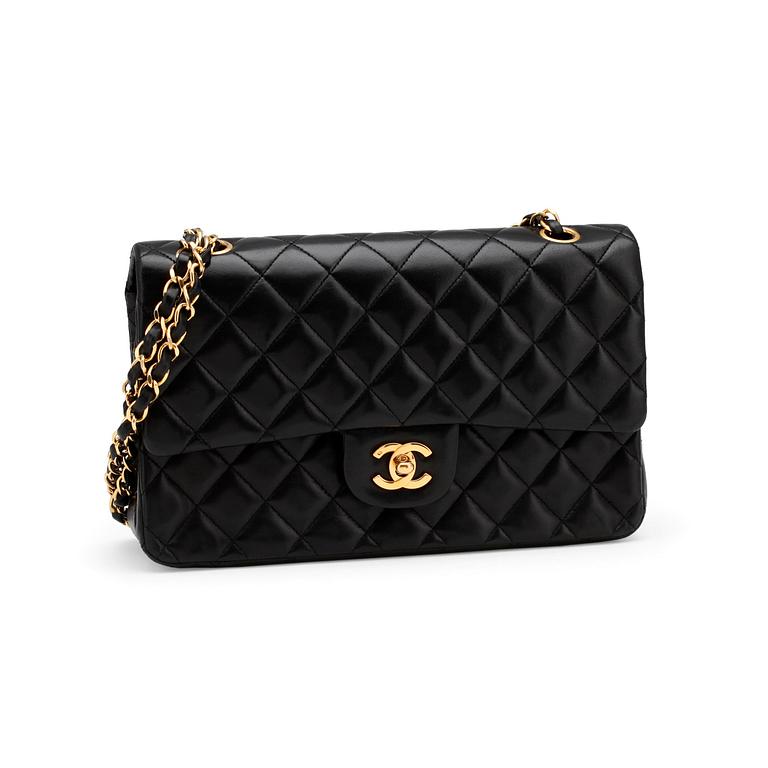 CHANEL, a quilted black leather "Double Flap" shoulder bag.