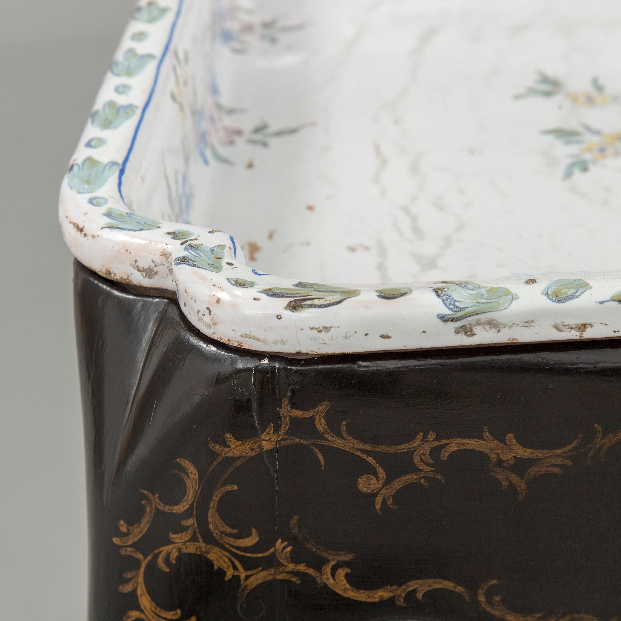 A Swedish Rococo faience tea table, Marieberg 1770.