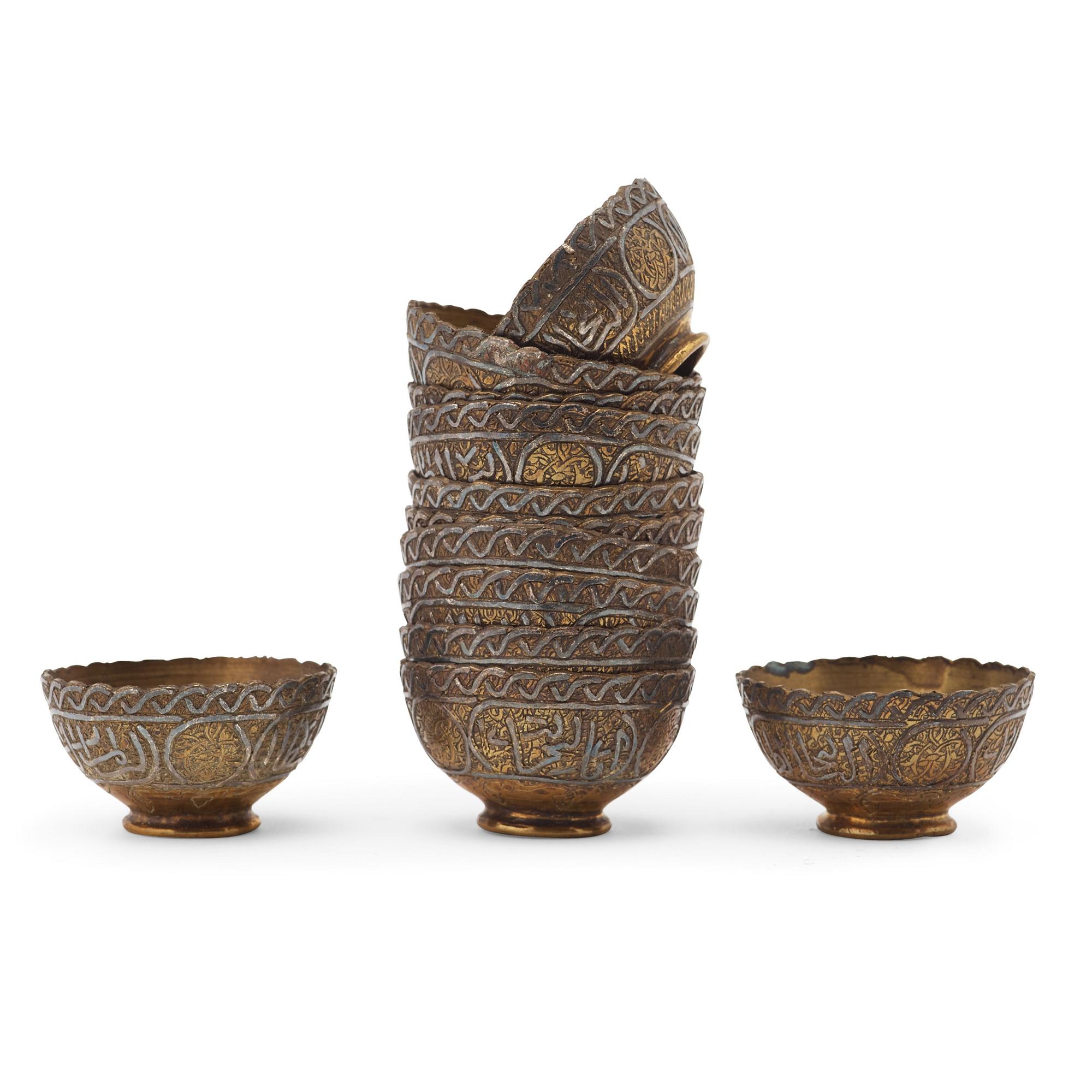 ZARFS, 12 PIECES. Metal. Height ca 3,5 cm each. Iran/Turkey, around 1900 - first half of the 20th century.